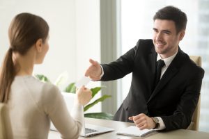 a lady give business card